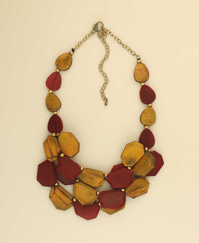 Yellow and red horn necklace with brass accents