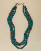 Handmade teal wood necklace with brass discs