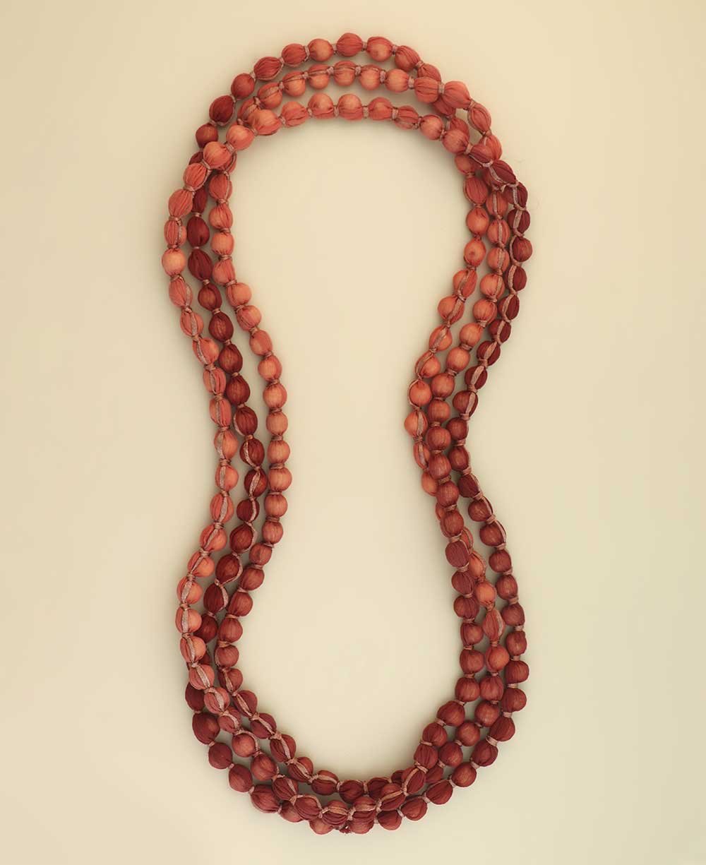 Multi-layer red and pink bead necklace