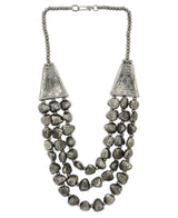 Rustic silver beaded necklace with tribal accents