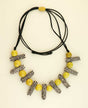 Black and white Iraca fiber necklace with yellow beads