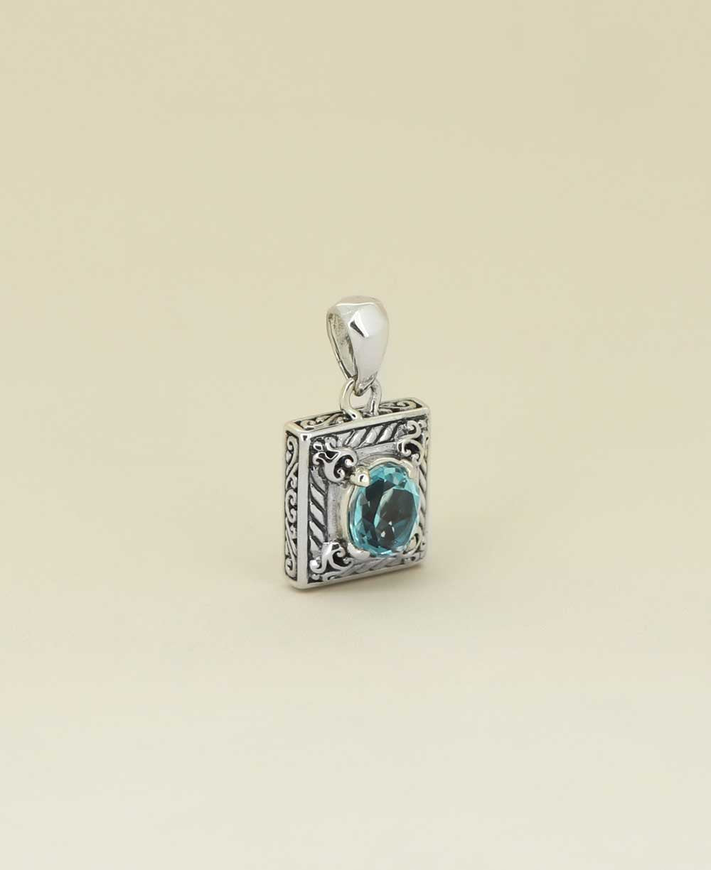 Faceted-blue-topaz-pendant-in-filigree-frame