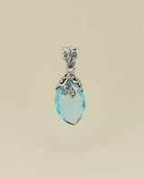 Artisan-crafted-silver-pendant-with-almond-blue-topaz