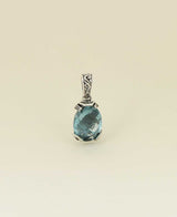 Artisan-silver-pendant-with-large-blue-topaz