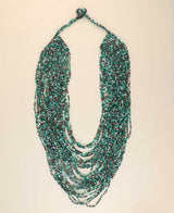 Multi-strand teal beaded necklace