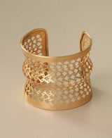 Handcrafted gold-tone lattice cuff bracelet.