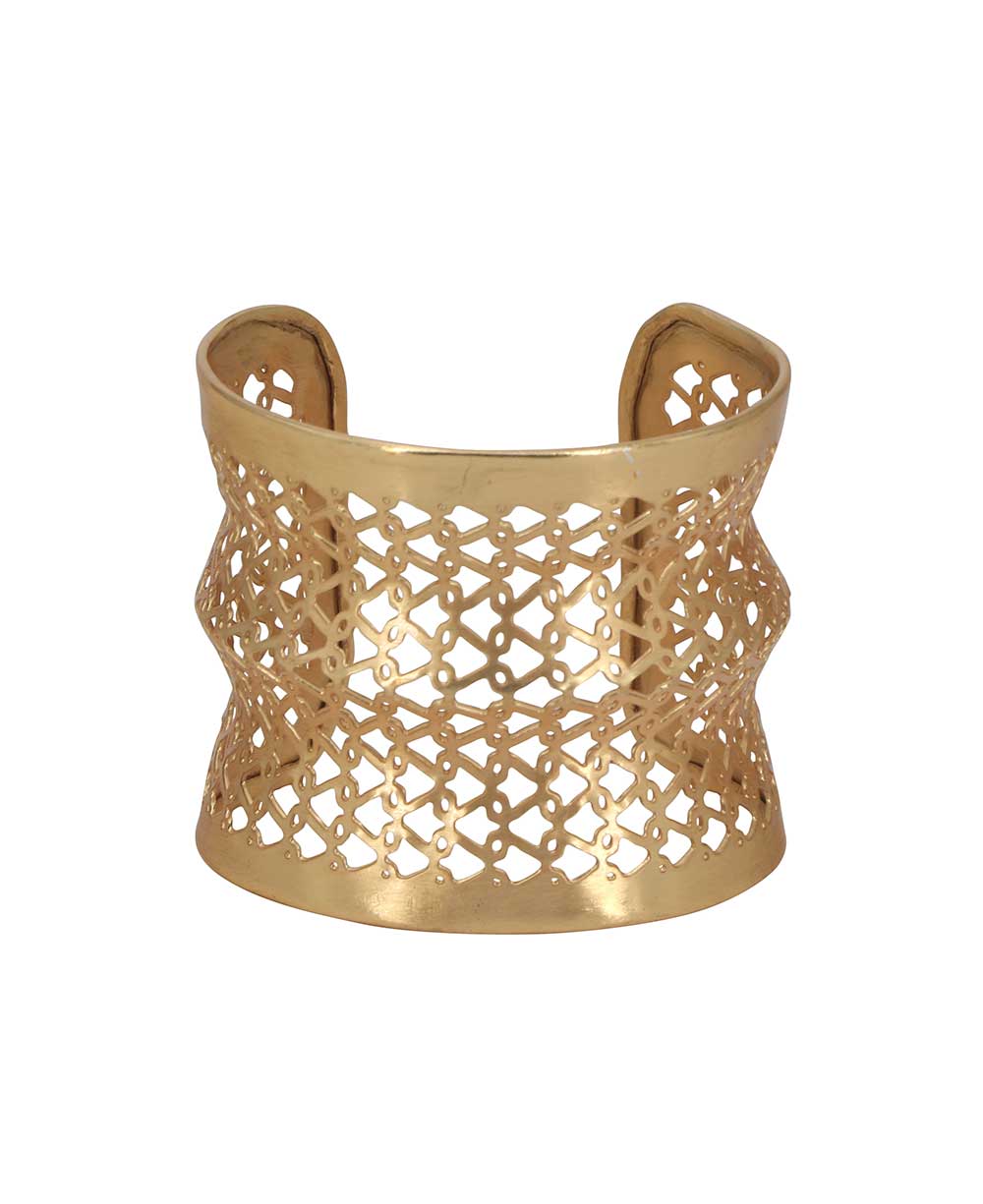 Gold-tone wide cuff bracelet with intricate lattice design.