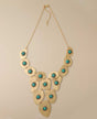 Gold-tone necklace with turquoise polymer clay beads.