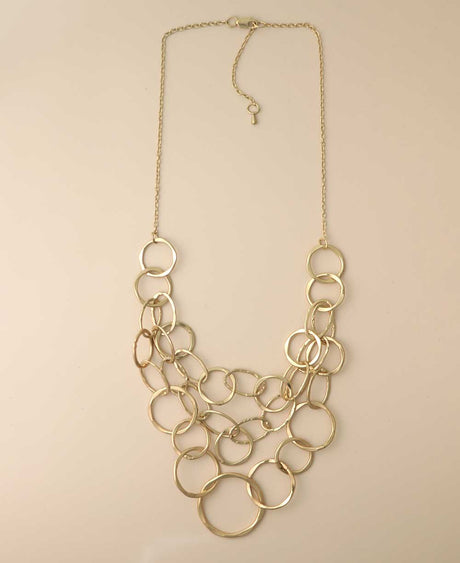 Gold-tone multi-layered hammered ring necklace.