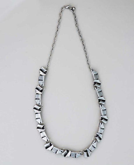 22-inch geometric pewter necklace with lobster clasp.