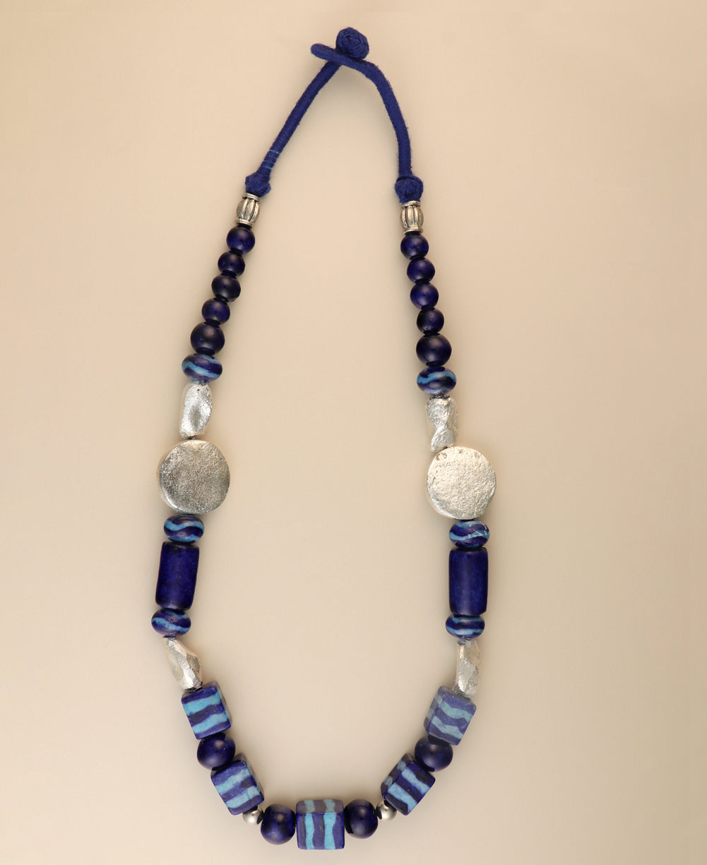 Hand-painted ceramic bead necklace with metal accents.