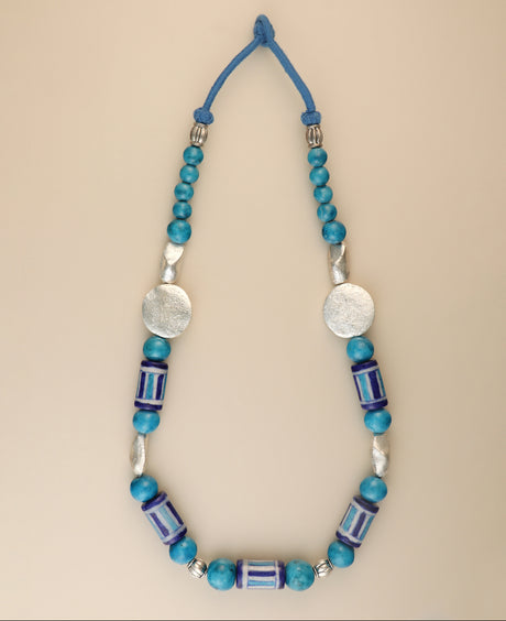 Hand-painted blue pottery bead necklace with metal accents.