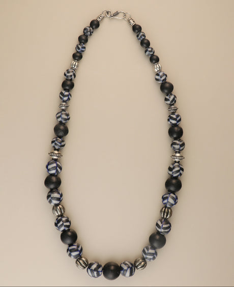 Black ceramic bead necklace with silver metal accents.