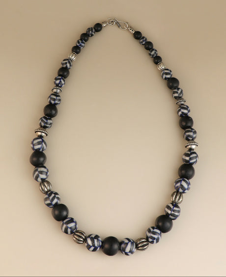 Hand-painted black and white ceramic bead necklace.