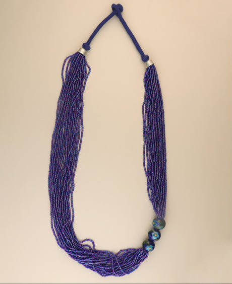 Hand-painted ceramic bead necklace in blue and green tones.