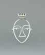 Close-up image of the sterling silver Picasso Face cut-out pendant