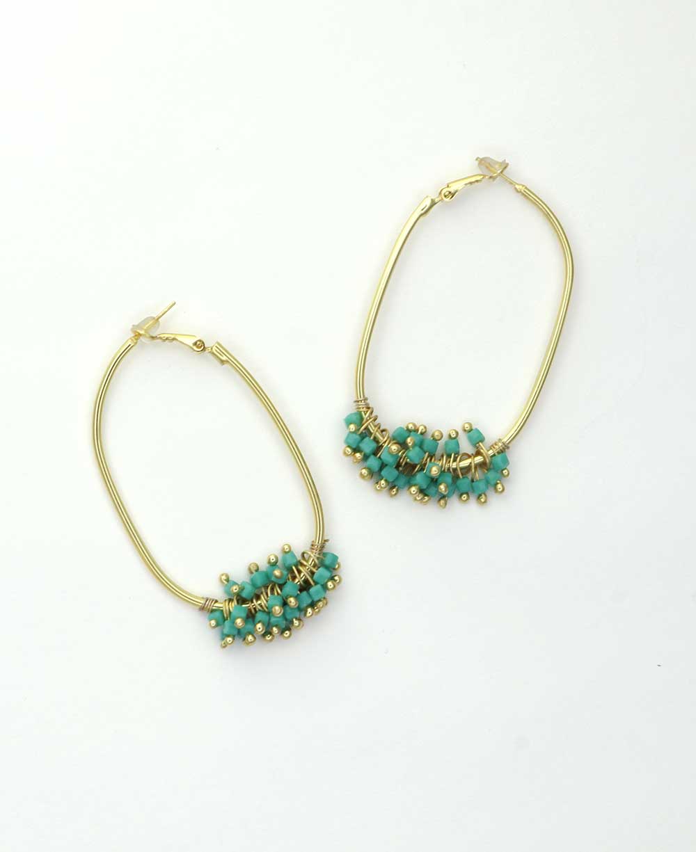 Gold-plated brass hoop earrings with aqua blue glass beads.