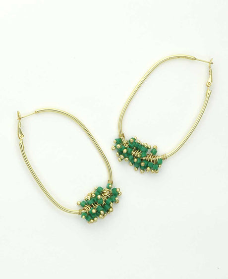 Gold-plated brass hoop earrings with green glass beads.