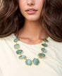 Organic-shaped blue agate necklace with gold-plating.