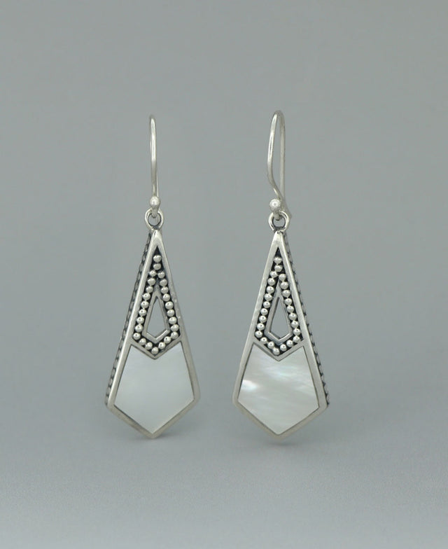 Full view of the sterling silver Mother of Pearl earrings against a light background, highlighting the geometric cutout design and radiant shell inlay