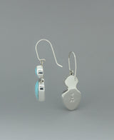 Sterling silver Genuine Turquoise dangling earrings, showcasing the unique hinged design and natural turquoise variations