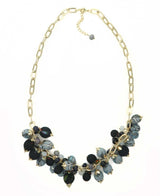 Beaded necklace is grey and black