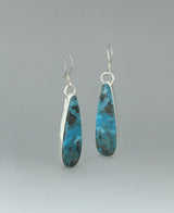 ull view of the sterling silver Genuine Turquoise earrings against a light background, emphasizing the vibrant Kingman turquoise