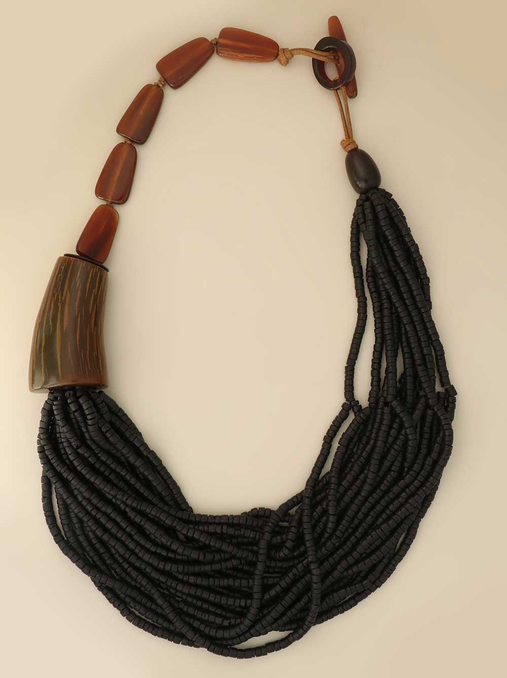 Asymmetric black horn and coconut bead necklace