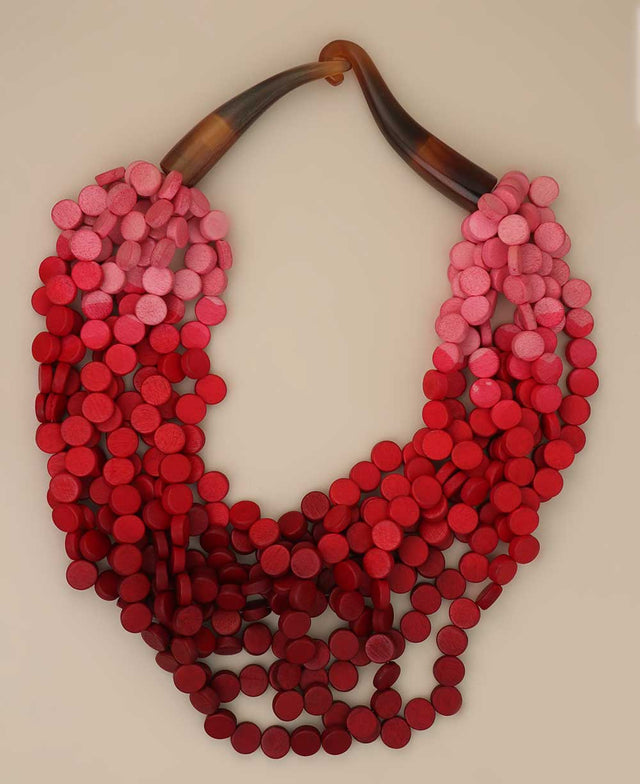 Shades of red and pink twisted wooden disc necklace