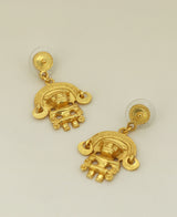 Tairona Symbol Earrings on a light background, emphasizing the detailed symbol and robust disc